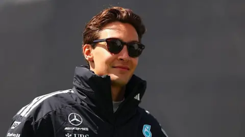 George Russell arrives in the Montreal paddock 