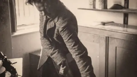 Dylan Thomas pictured in a rage with a cigarette in his mouth