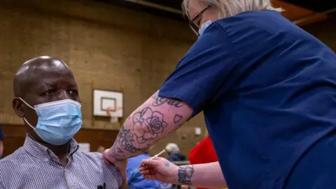 Getty Images A man is vaccinated n Newbridge