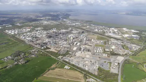 EET Fuels, formerly Essar, oil refinery in Ellesmere Port, from above with fields to the left and the River Mersey to the far right