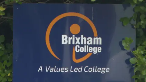 Brixham College sign outside the main gates saying "Brixham College, a Values Led College