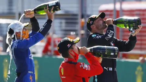 Getty Images Lando Norris prefers the taste of milk to champagne. Seriously, he does.