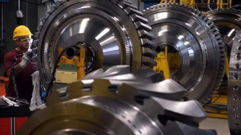 Getty Images An employee of German industrial giant Siemens, works on a rotor as a part of a Gas Turbine in the turbine plant on November 8, 2012 in Berlin.