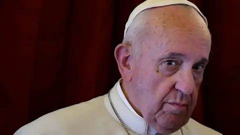 Reuters Pope Francis looks on as he addresses reporters aboard the plane bringing him back following a two-day trip to Morocco March 31, 2019