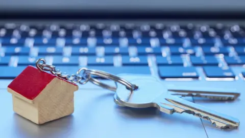 Getty Images House keys on a laptop