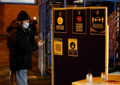 Action Images via Reuters A Luton Town fan wearing a protective face mask stands outside the stadium before the match
