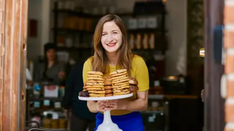 Ovenly Agatha Kulaga holds chocolate chip cookies