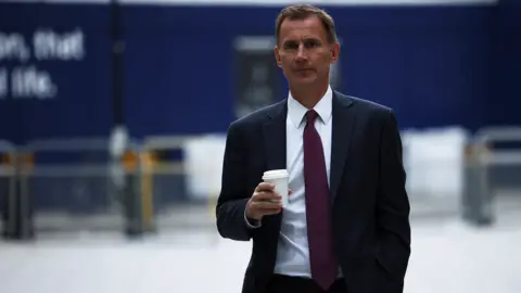 Reuters Jeremy Hunt arriving at the BBC on Saturday