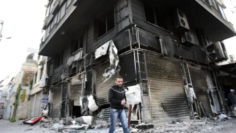 Getty Images Damage caused by bombing in the Syrian city of Latakia