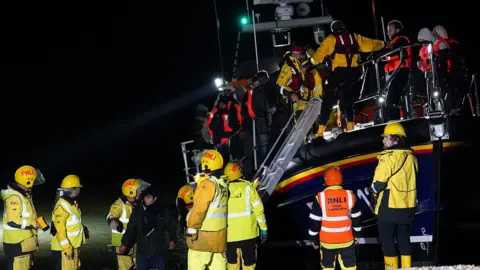 PA Media RNLI crews rescuing people thought to be migrants on Wednesday evening