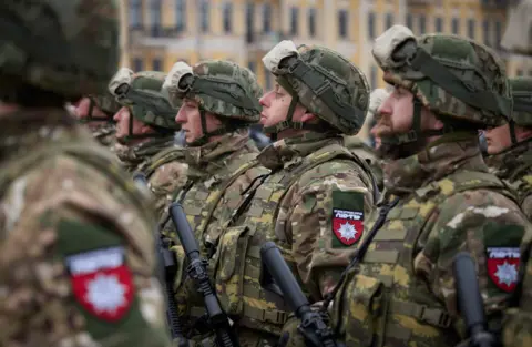 UKRAINIAN PRESIDENTIAL PRESS SERVICE Servicemen stand to attention during a ceremony dedicated to the first anniversary of the Russian invasion of Ukraine, amid Russia's attack on Ukraine, in Kyiv, Ukraine February 24, 2023