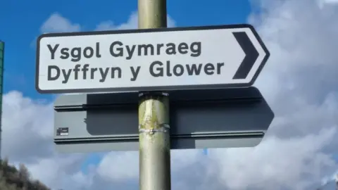 BBC A sign reading "Ysgol Gymraeg Dyffryn y Glower" 