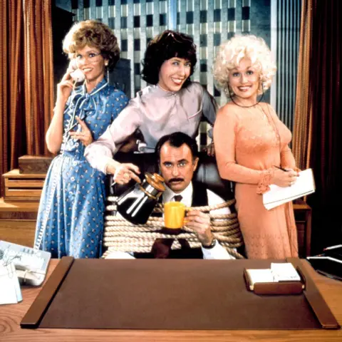 20th Century Fox via Alamy Jane Fonda, Lily Tomlin, Dolly Parton, Dabney Coleman in a promotional image for 9 to 5. 