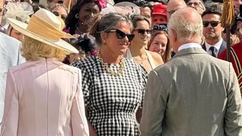 Harry Weller Tracey Emin speaking to the King and Queen at a Buckingham Palace garden party