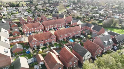 An areal footage of the  Alder View in Harwell on a cloudy day