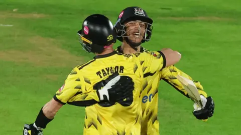 Matt Taylor and Kamran Dhariwal after securing victory for Gloucestershire away at Glamorgan