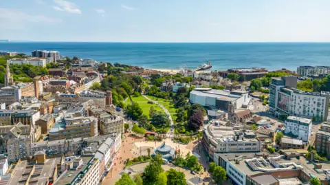 Getty Images Bournemouth town centre with sea in the background on a sunny day