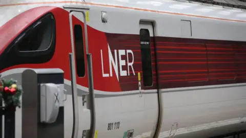 A London North Eastern Railway (LNER) train seen at King's Cross station.