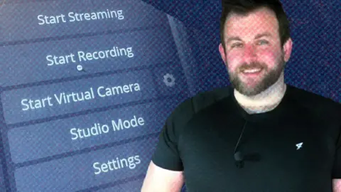 A man with a beard and a tight black 