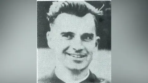 Family handout Black and white image of Fr Noel Fitzpatrick, blurred at the sides. He has dark hair, wearing priest clothing. He is smiling and looking off to his side.