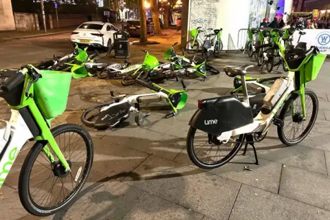 Getty Images Lime bikes outside Waterloo Station in London, October 2023