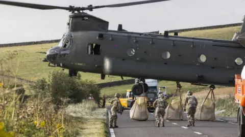 Cpl Rob Travis RAF/MoD/Crown Copyright/PA Media Bags loaded on to Chinook