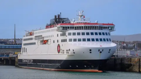 The Manxman, which is a large white, red and black ferry, moored in Douglas Harbour.