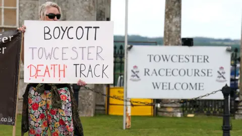 PA Media Protester at Towcester Racecourse