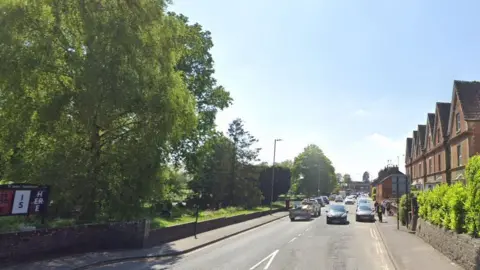 Google Maps Estcourt Street in Devizes under blue sky with traffic