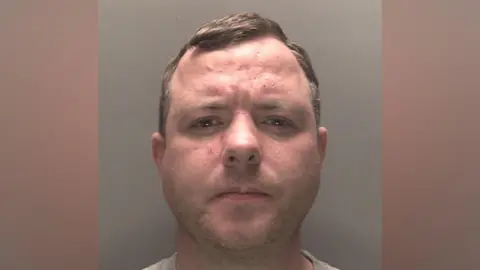 Merseyside Police A mugshot of James O'Donnell, 35, who has dark blonde hair and light stubble, staring into the camera with a concerned expression. 