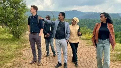 National Trust Michael Harvey pictured with Ethiopian colleagues in the countryside in Ethiopia