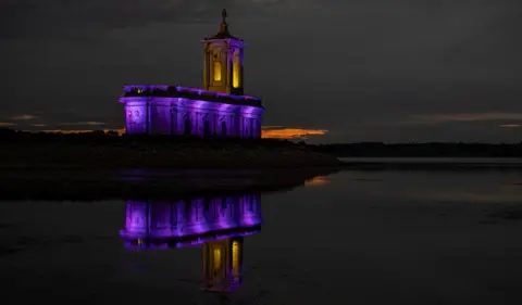 Richard Brown Normanton Church at Rutland Water lit up in purple in tribute to the Queen