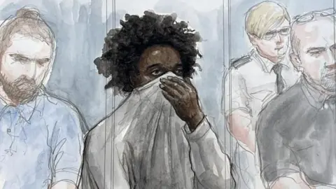 A courtroom sketch shows Southport attacker Axel Rudakubana with a jumper pulled up over his mouth and nose. 