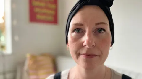 BBC Claire wearing a head scarf