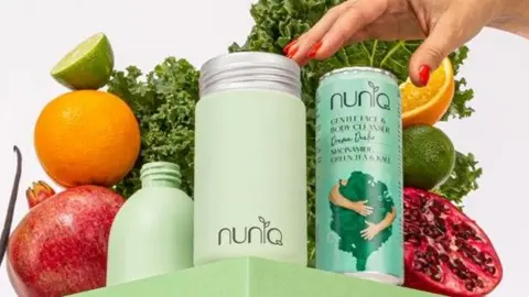 Meadow A can of body cleanser next to a dispenser