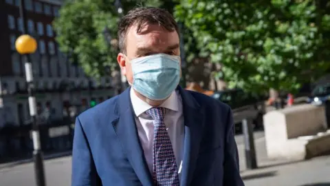 PA Media Previously unissued photo of Andrew Griffiths arriving at the Royal Courts of Justice in London in July 2021