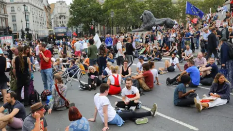 EPA Anti Brexit protesters block the road and stop traffic in Trafalgar Square following a protest against Brexit and the prorogation of parliament in London,