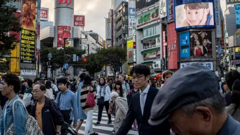 Getty Images Japanese workers in Tokyo