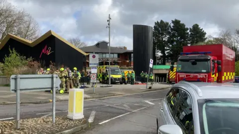 Andrew Woodger/BBC Emergency service vehicles outside the Spiral car park and New Wolsey Theatre in Ipswich