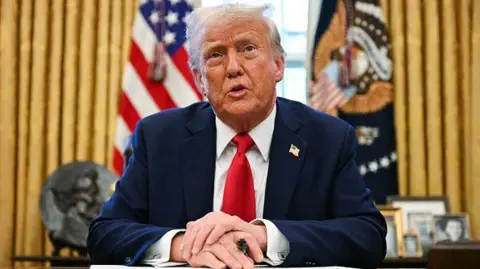 Getty Images US President Donald Trump speaks to the press as he signs an executive order to create a US sovereign wealth fund, in the Oval Office of the White House on February 3, 2025