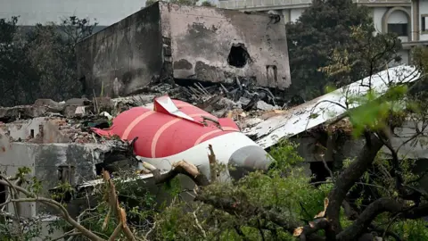 AFP/Getty Images Debris of the Air India flight 171 after it crashed in a residential area near the airport in Ahmedabad.