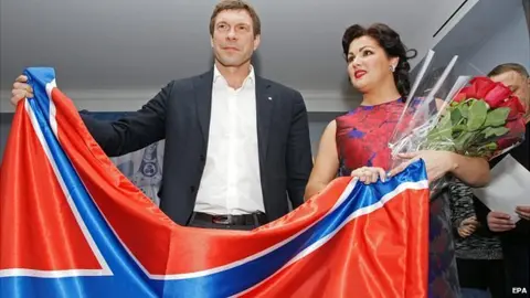 EPA Anna Netrebko with rebel leader Oleg Tsarev and flag