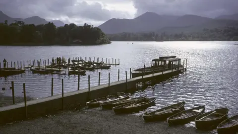 PA Media The shore at Derwent Water in Keswick