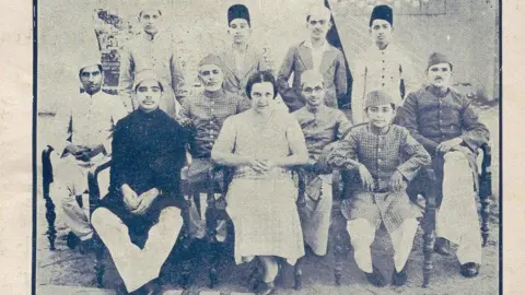 Payam-e ta'lim Gerda Philipsborn sitting with the team running Payam-e ta'lim, Jamia's children's journal. 