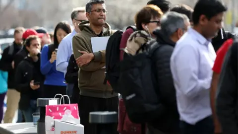 Getty Images Queue of people outside SVB bank branch in California