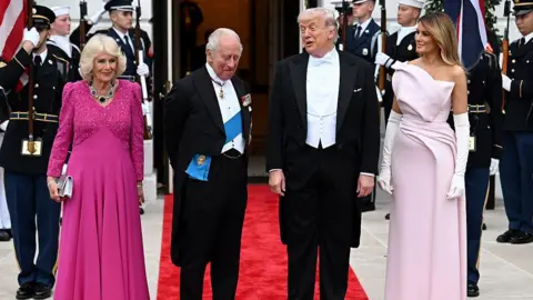 Getty Images Queen Camilla, King Charles III, U.S. President Donald Trump, and First Lady Melania Trump pose outside during an official state dinner 