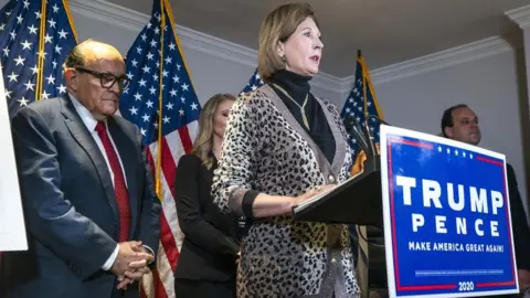 EPA Attorney Sidney Powell (C), a member of US President Donald Trump's legal team, speaks alongside Trump lawyer and former mayor of New York City Rudy Giuliani (L) about the president's legal challenges to his election loss to President-elect Joe Biden in the Republican National Committee Headquarters in Washington, DC, USA, on 19 November 2020