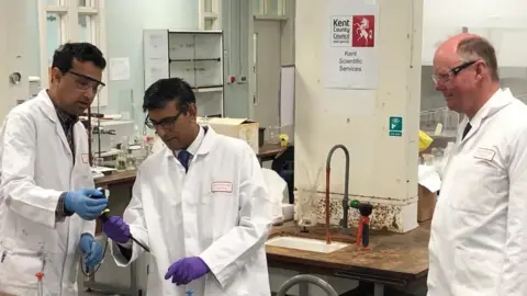 BBC The prime minister, England's chief medical officer and a scientist in a lab which tests vapes and other products