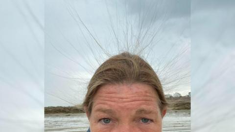 Natalie Stevens static hair at beach