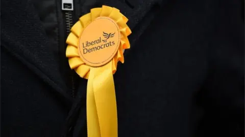 AFP/ Getty Images Lib Dem Rosette